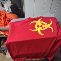 yellow toxic waste symbol on red t-shirt