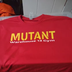 Screen-printed red t-shirt with the red mutant on it.